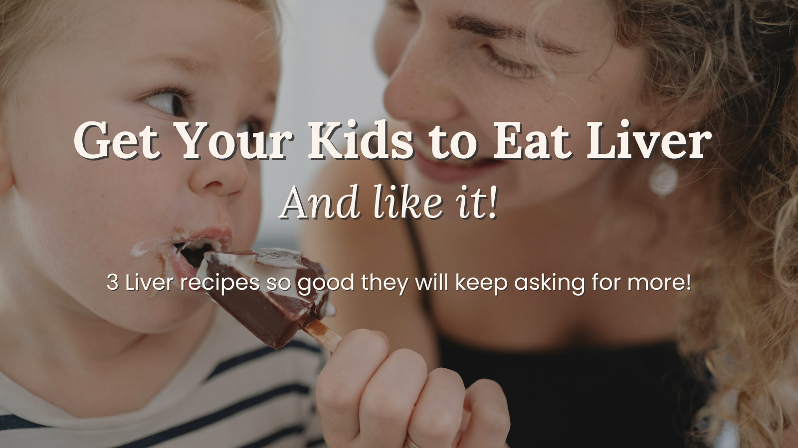 Mom smiling at child eating a chocolate fudge pop made with hidden liver for kid-friendly liver recipes