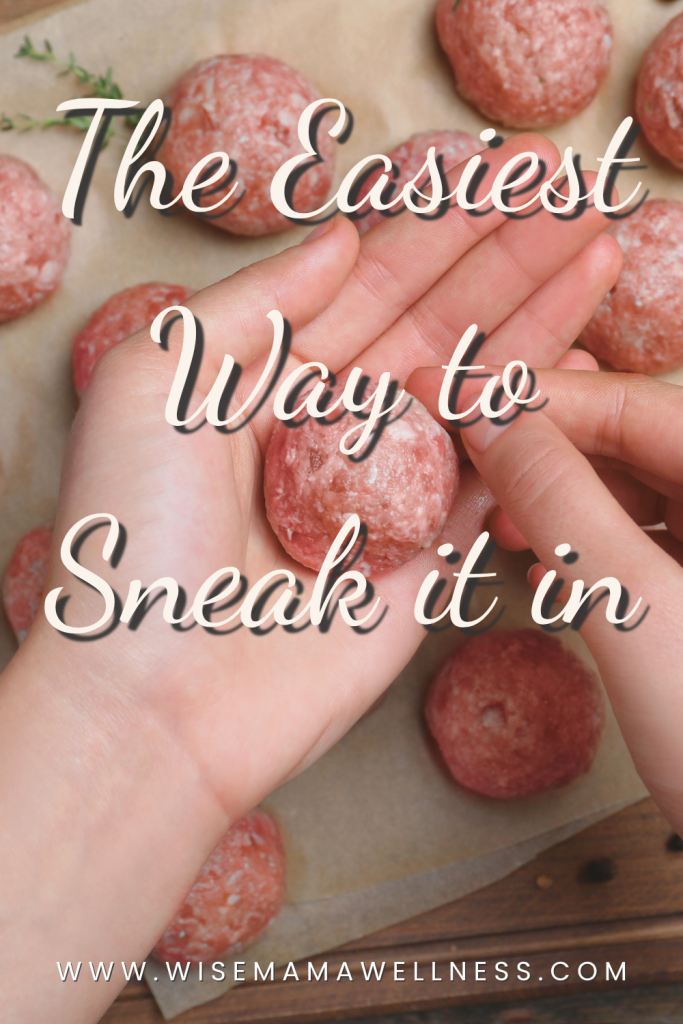 Hands rolling meatballs with herbs and spices, demonstrating how to blend liver into ground meat so kids get tooth-strengthening nutrients without noticing